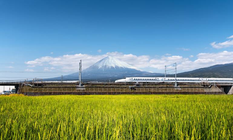 The shinkansen bullet train passing Mt Fuji