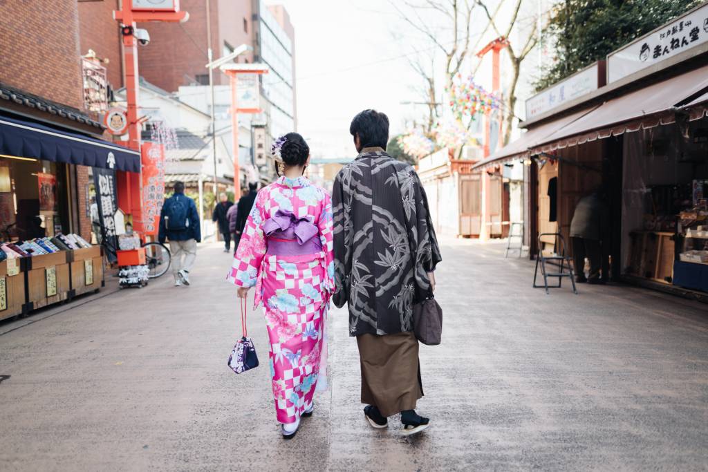 Couple in kimono holding hands
