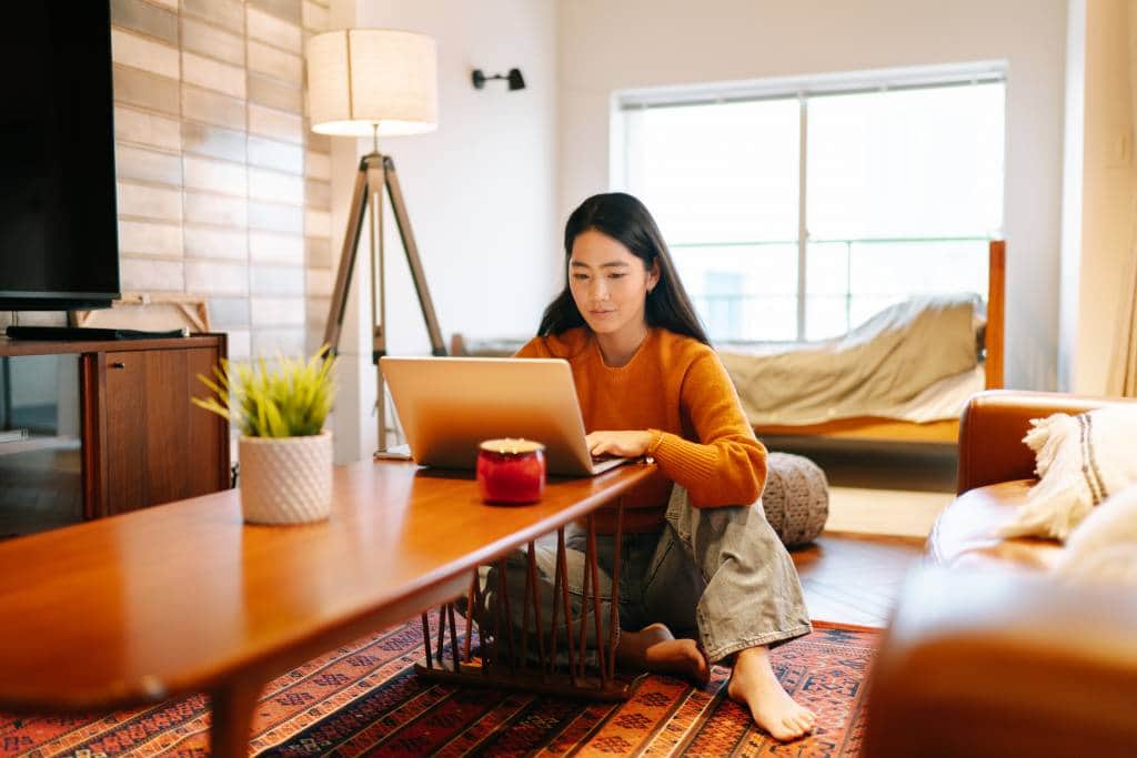 woman on laptop working from home japan